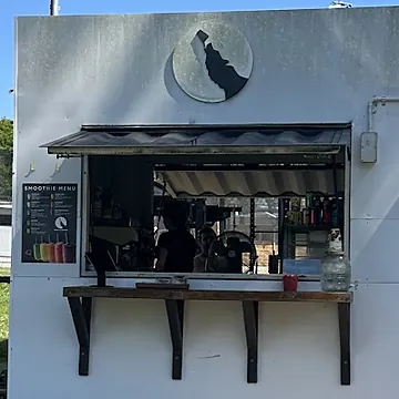 The coffee window with the smoothie menu board beside it